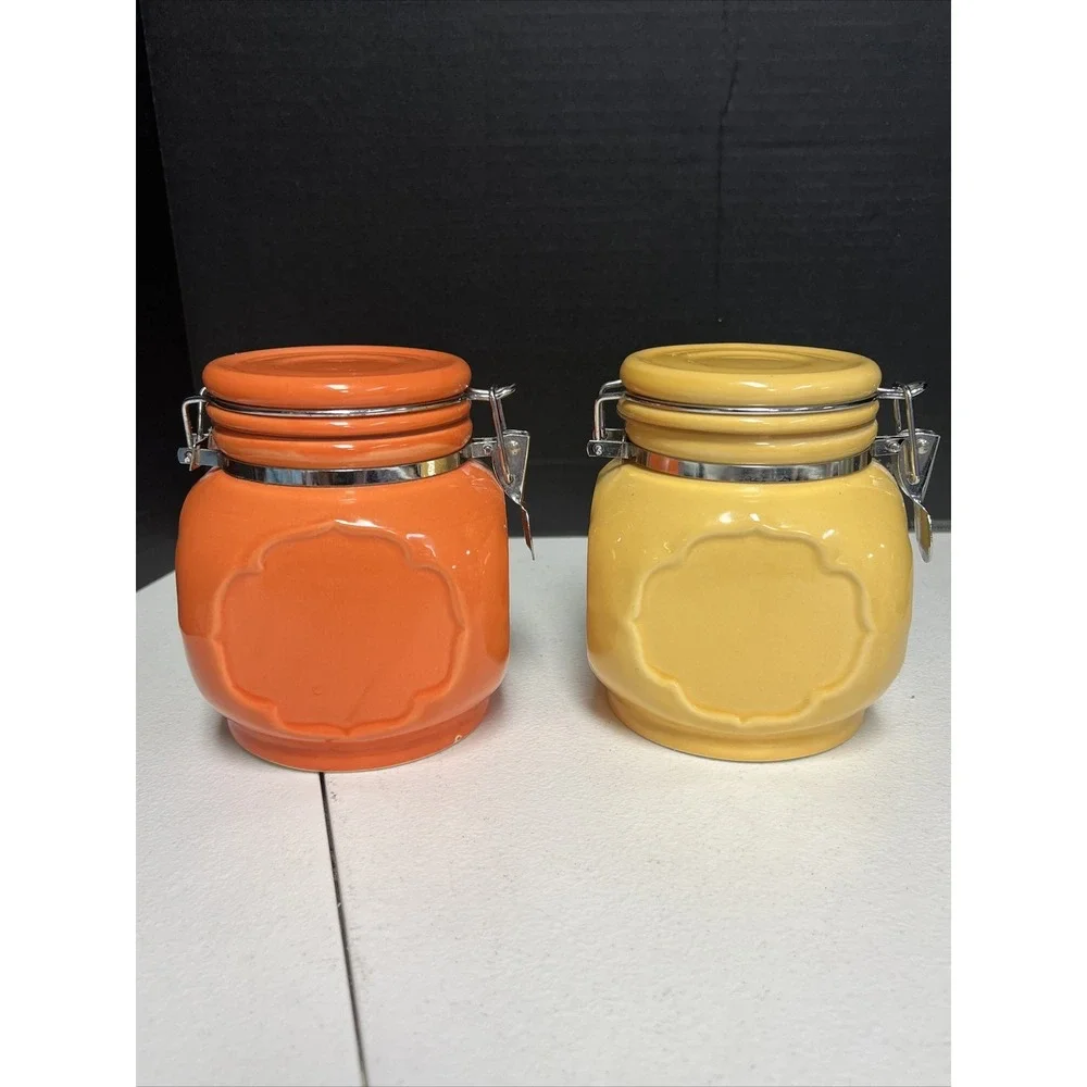 Set Of 2 Orange And Yellow Ceramic Jars With Locking Lids